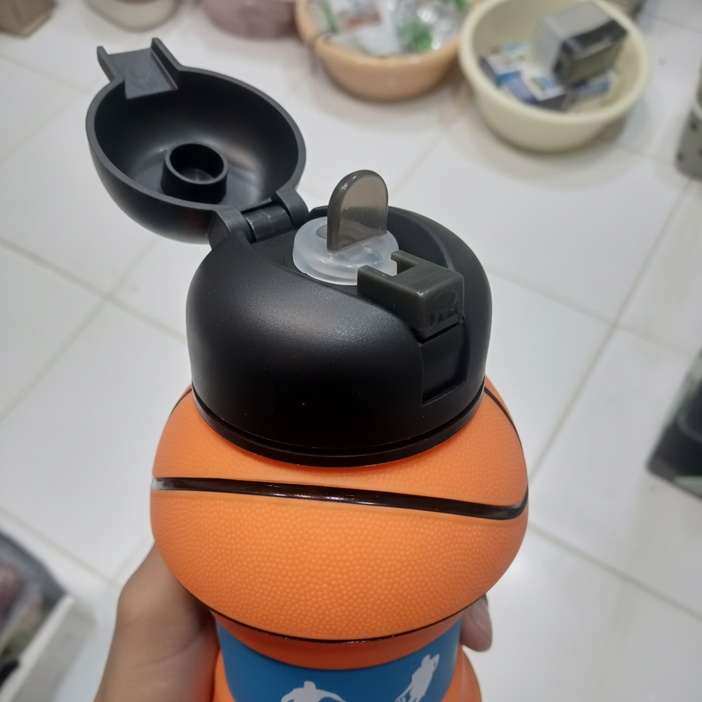 Close-up detail of flip-top lid and basketball texture